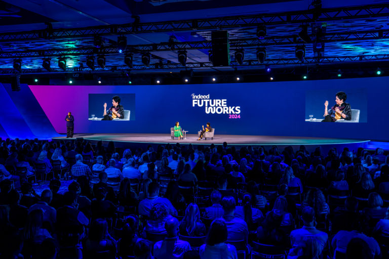 event stage with speakers having a conversation